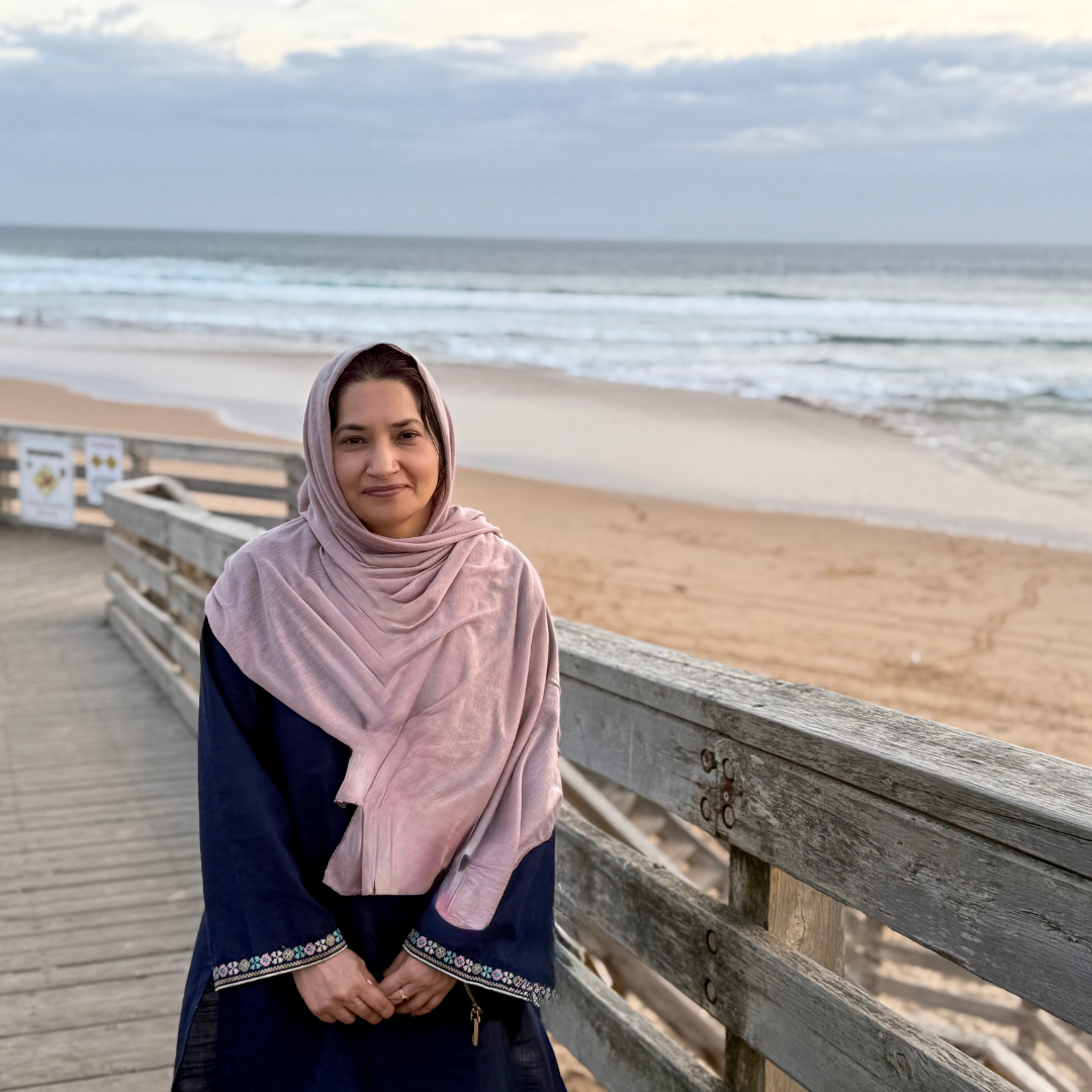 Baby pink and Minimal Social Media Profile Pictures Portrait of a qualified homeopath, MA, LCHE, RSHom, smiling on a beach